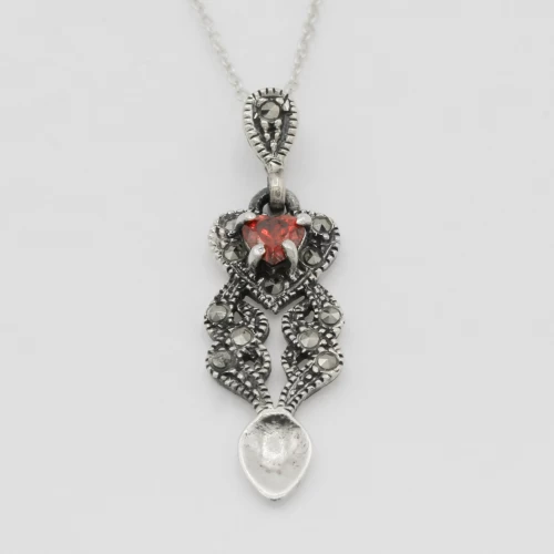 A product image for the product Sterling Silver Gemstone Lovespoon Necklace (Garnet).