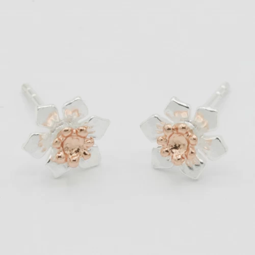 A product image for the product Sterling Silver and Rose Gold Daffodil Stud Earrings.