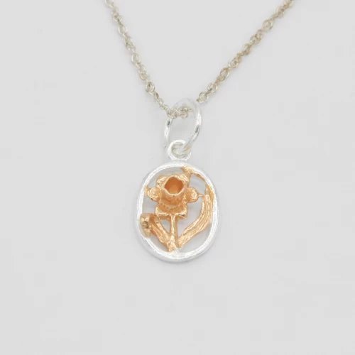 A product image for the product Sterling Silver & Rose Gold Oval Daffodil Necklace (Small).