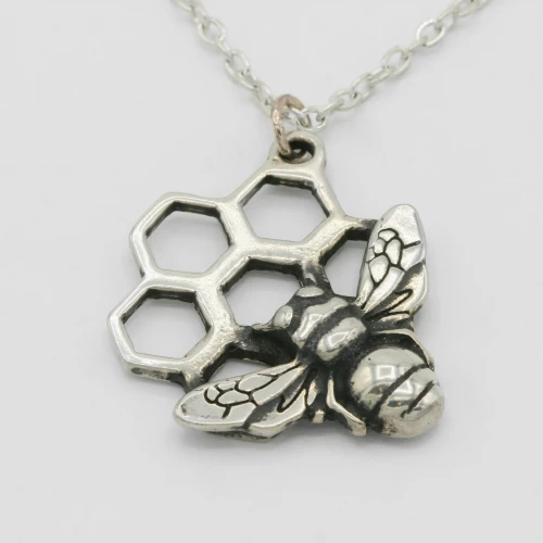 A product image for the product Pewter Bee Honeycomb Necklace.