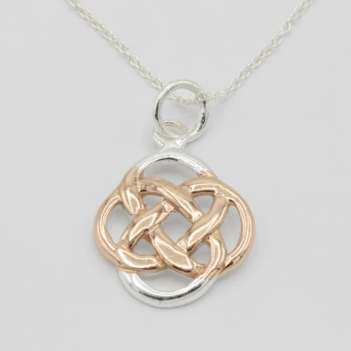 A product image for the product Sterling Silver & Rose Gold Celtic Knot Necklace.