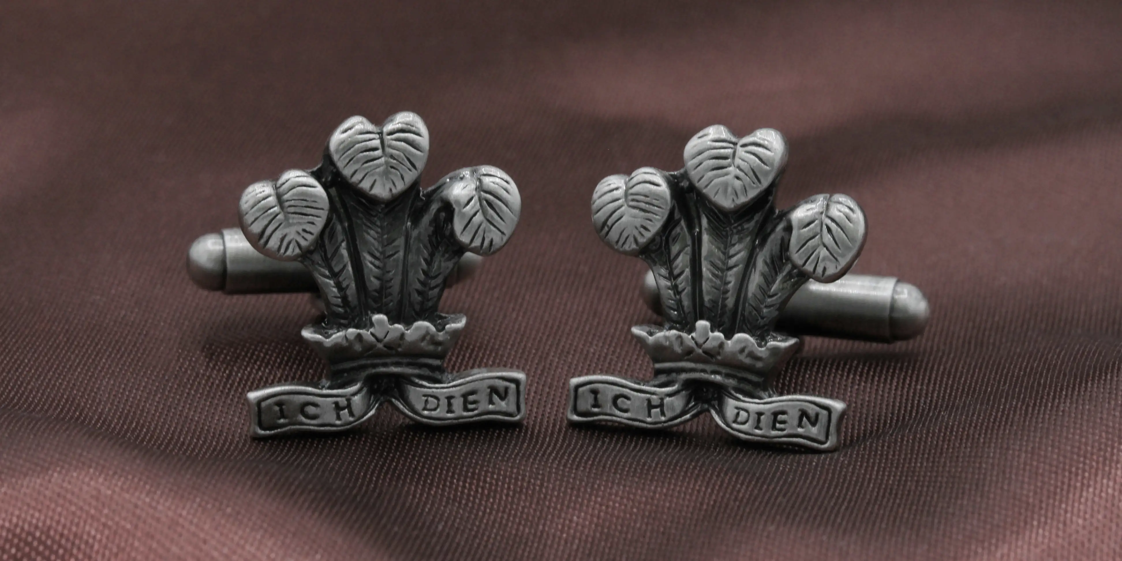 Main category image for Cufflinks and Brooches featuring a pair of cufflinks of the Price of Wales feathers.